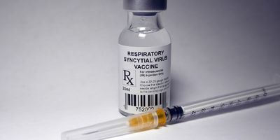 Respiratory syncytial virus vaccine vial and an unused syringe