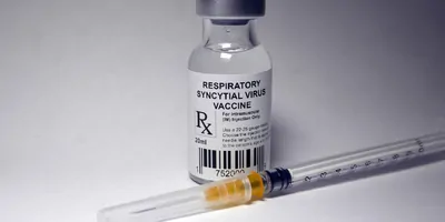Respiratory syncytial virus vaccine vial and an unused syringe
