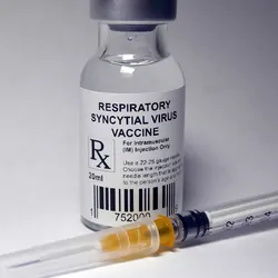 Respiratory syncytial virus vaccine vial and an unused syringe