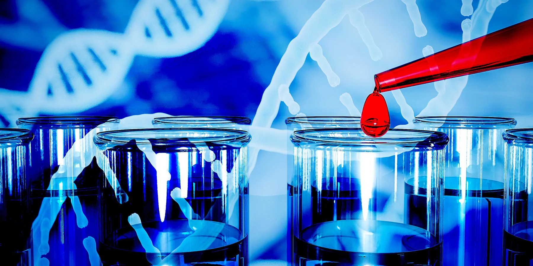 A glass dropper adds a big drop of red liquid to filled test tubes against a background of a graphical illustration of DNA double helices.