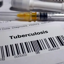 Tuberculosis test requisition with a syringe in the background.