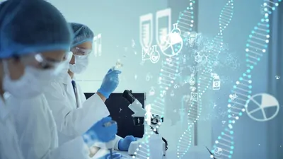 Two researchers wearing hair nets, masks, gloves, and white lab coats examine microscope and liquid filled beakers in a laboratory. Printed DNA strands run across right side of the image.
