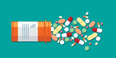 Vector illustration of pills and capsules of various shapes, sizes falling out of a prescription bottle.