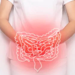 The doctor holds the results of the examination of a patient with intestinal inflammation and abdominal pain.