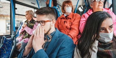 People using public transportation every day wearing facial masks against diseases and flu.
