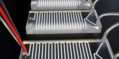 Isolated microfluidic chip with blood sample inside of micropipette 3D-rendered against a black background