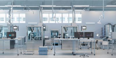 3D render of a laboratory and manufacturing facility with scientific monitors on desks. 
