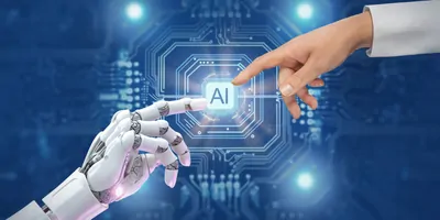 A white cyborg robotic hand pointing a finger to a human hand with a stretched finger against a background with circuits and "AI" written.