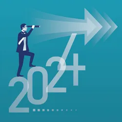 A businessman with a telescope looks at the next year 2024.