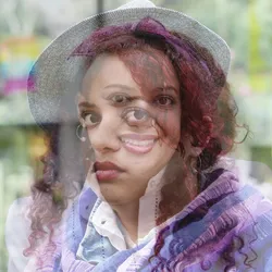 Multiple exposure image of a woman smiling and looking unhappy, indicating poor mental health.