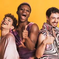 Multiracial LGBTQ people gesturing to be fine with a thumbs-up.