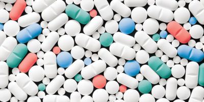 Lots of pills in mostly white, some red, blue, and green