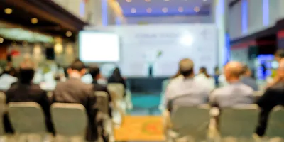 Blurred image of participants at ADLM 2026 conference