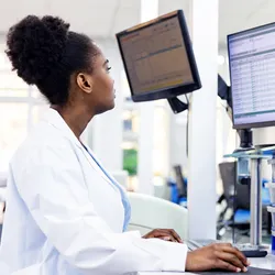 Clinical scientist working with a clinical analyzer