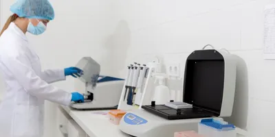 Laboratory technician analyzing urine samples for arsenic contamination