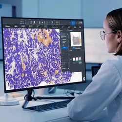 Image of lab worker viewing pathology data