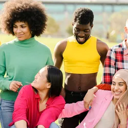 A cheerful multiracial group of happy friends in the park having fun.