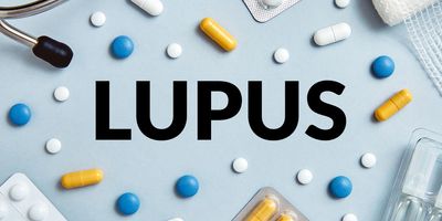 The word Lupus is surrounded by pills and medical supplies on a blue background.