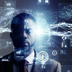 Graphical vectors of medicine, health, automation, graphs, and bar charts float against a background of a man in a suit and tie with his eyes closed.