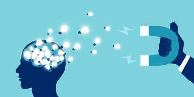 Illustration concept of someone holding a magnet that is pulling small lightbulbs out of a human brain against a blue background.