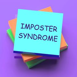 Photo of a pile of sticky notes on a purple background with the top sticky note reading “imposter syndrome.”