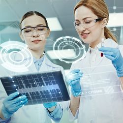 Clinicians reviewing lab test results on a tablet