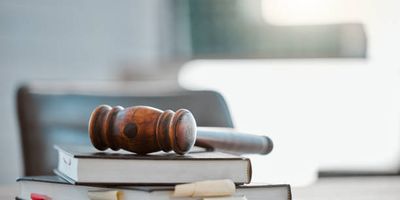 Judge’s gavel on legal reference books