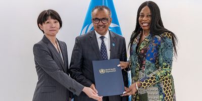 Three people holding a memorandum folder