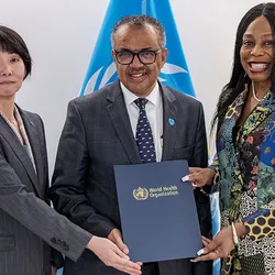 Three people holding a memorandum folder
