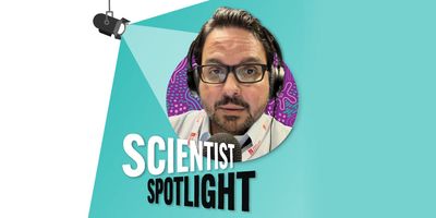 A portrait headshot of Luis Plaza with an illustrated stage spotlight shining down onto him from above.