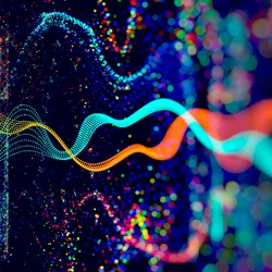 Illustration of colourful light particles dancing randomly across a dark plane.