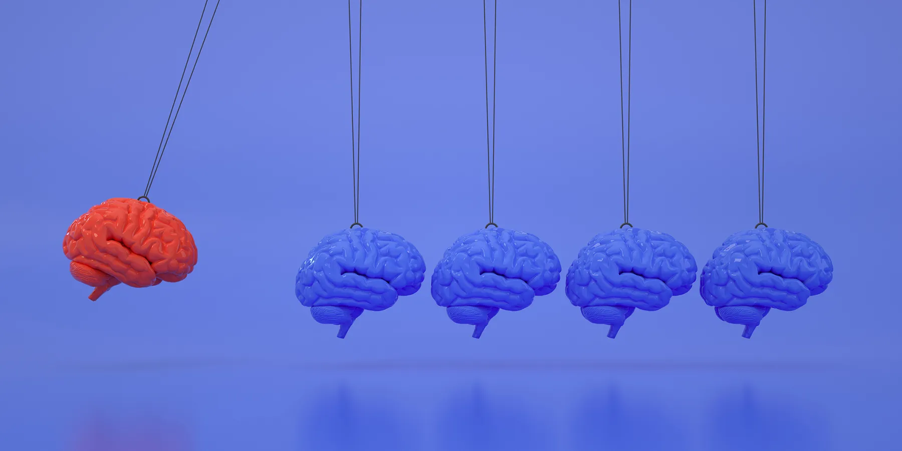 Illustration showing five human brains where four of them are colored blue and one is colored red.