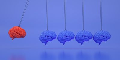 Illustration showing five human brains where four of them are colored blue and one is colored red.