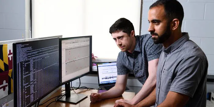 Photo of Johns Hopkins geneticists Dylan Taylor (left) and Rajiv McCoy in their clinical genetics laboratory.