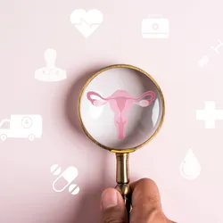 Illustration of a person’s hand holding a magnifying glass on top of a drawing of the uterus and fallopian tubes on a pink background.
