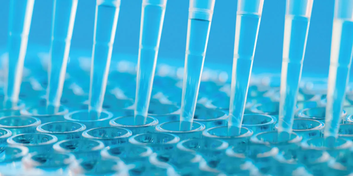 steroid-hormone-analysis-with-supel-swift-hlb-dpx Photo of pipette tips in the clinical laboratory with a blue background.