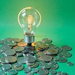 Image showing coins surrounding an idea lightbulb. The Laboratory Integration Strategic Association is leading an effort to crowdsource LDT development in reaction to FDA regulations.