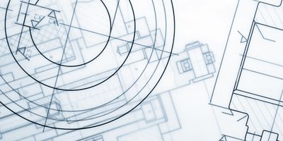 Photo looking down at different laboratory design blueprints.