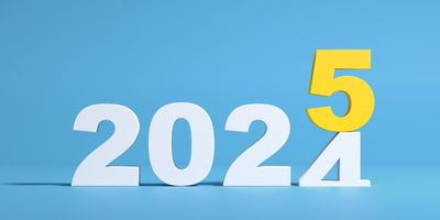 Photo of the numbers 2024 turning into 2025 on a blue background.
