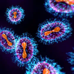 Illustration of blue and purple Nipah virus particles against a dark background.