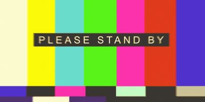 A TV screen advises viewers to “please stand by.” The Trump administration’s pause in federal health communications is being watched by clinical lab workers.