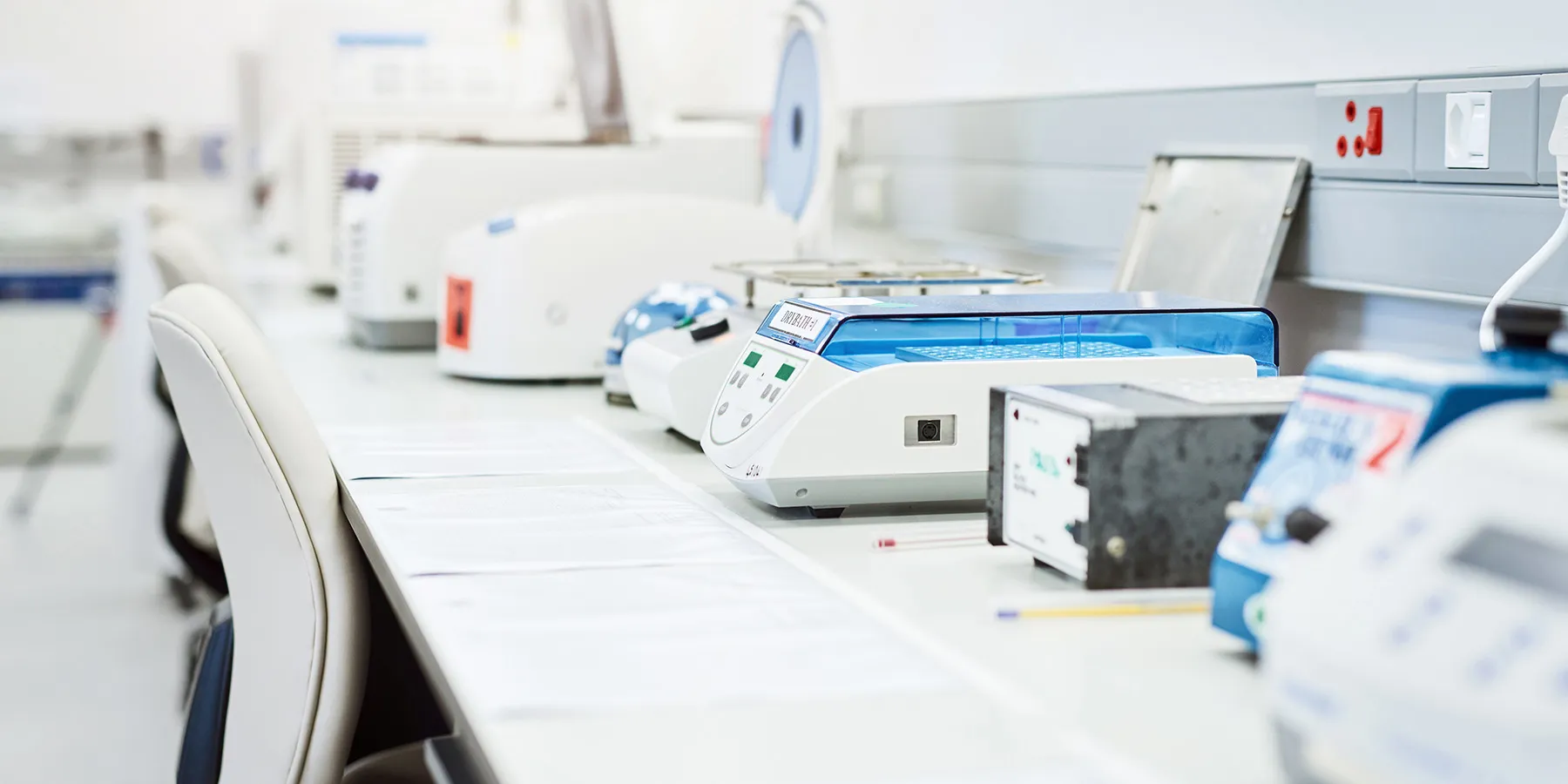 Photo of bench top analyzers used to test genetic material in a clinical laboratory. 