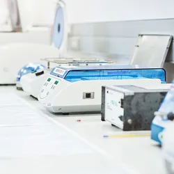 Photo of bench top analyzers used to test genetic material in a clinical laboratory.