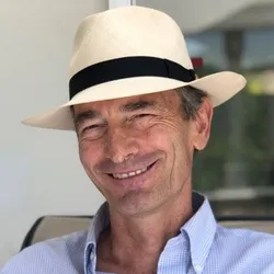 Photo portrait of Andrew Bradbury, PhD, wearing a white hat.
