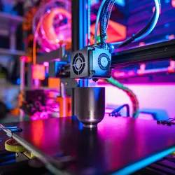 Photo of a 3D printer in a research laboratory printing a biotech medtech clinical device.