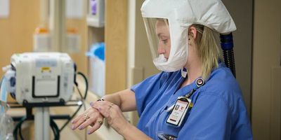 A healthcare provider cleans their hands. Hand hygiene is a crucial measure to prevent the invisible spread of C. difficile and other infections.