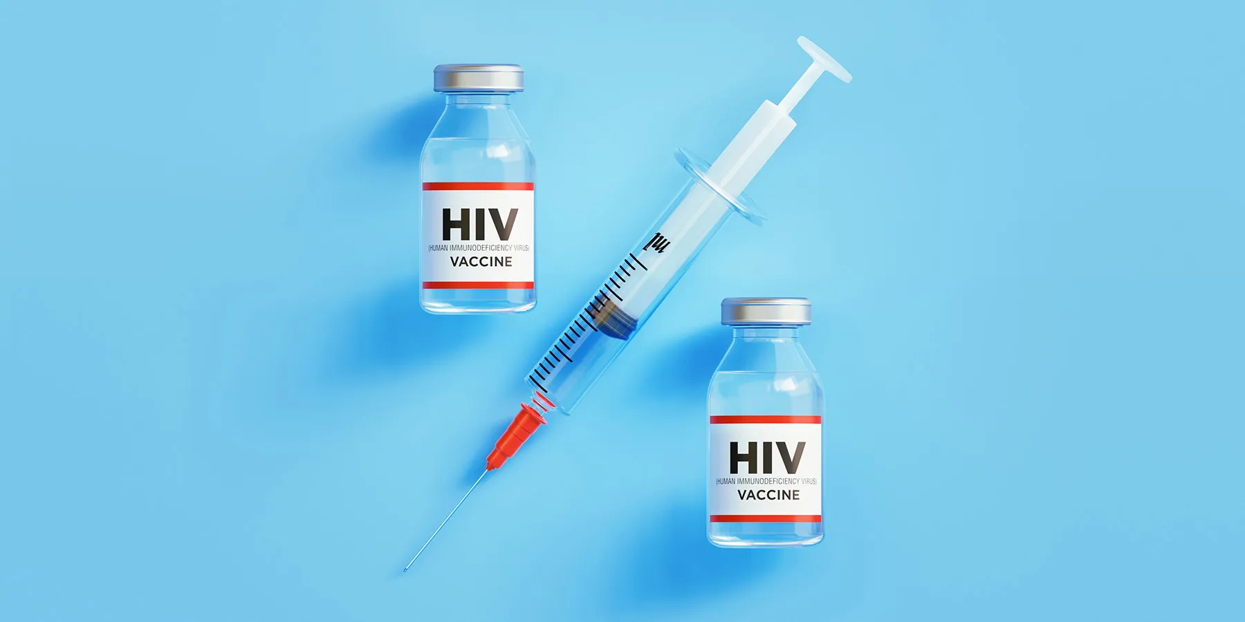 Photo of two HIV vaccine glass vials and a syringe against a light blue background.