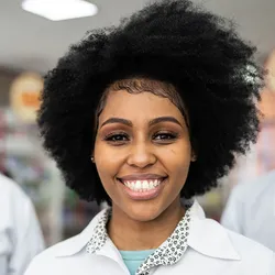 Pathologists wearing white lab coats and smiling, highlighting low burnout rates in 2025.
